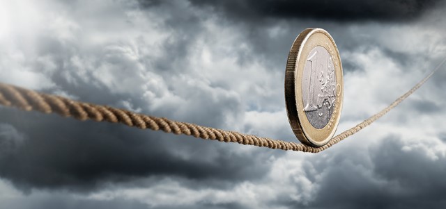 euro coin rolling unto a rope