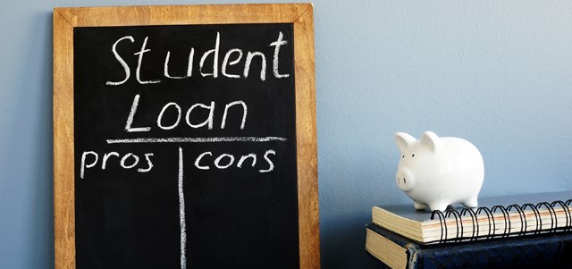 Student Loans Pros and Cons Written in Chalk on a Blackboard