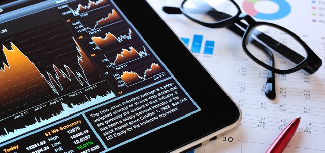 Stock Market analyze with iPad stock photo (©iStockphoto.com/hocus-focus)
