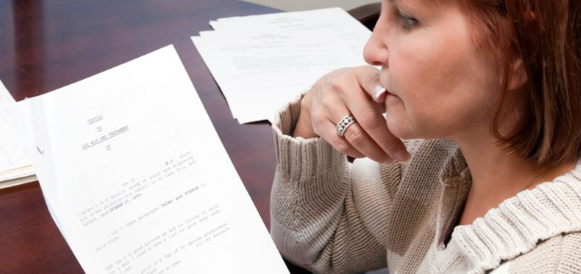 woman looking at financial documents
