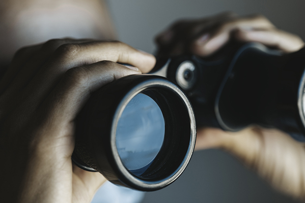 Person using binoculars