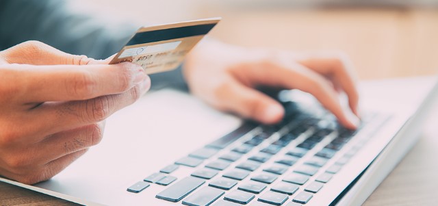 Man making online purchase with credit card ©iStockphoto.com/MangoStar_Studio