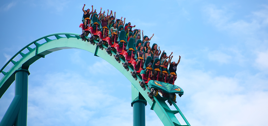 People riding a rollercoaster ©iStockPhoto/bukharova