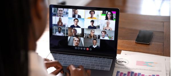 Woman Meeting Virtually with Co-Workers